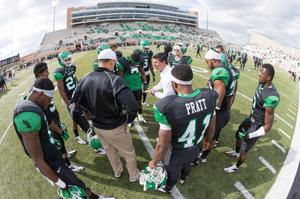 [UNT Mean Green football players 3]