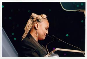 Primary view of object titled '[Kim Fields Speaking on Stage]'.