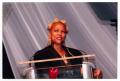 Photograph: [Kim Fields Speaking at Podium on Stage]