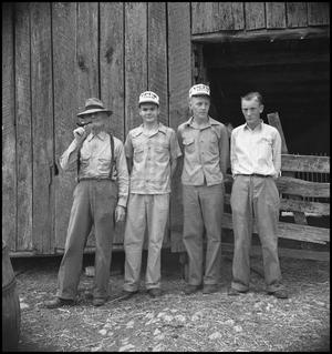 [Pappy, Raymond and two others in front of a barn]