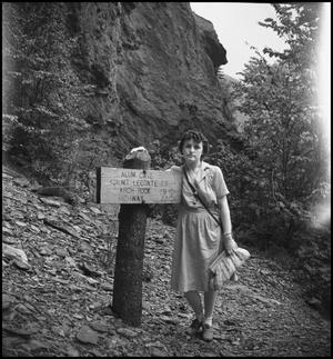 Primary view of object titled '[Bernice posing with the Alum cave sign]'.