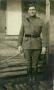 Photograph: [Photograph of a soldier in uniform at military camp]