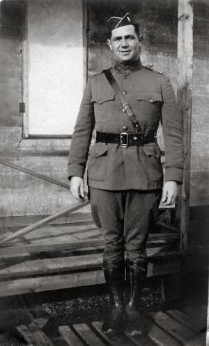 [Photograph of a soldier in uniform at military camp, 2]