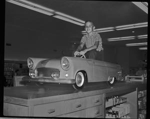 [Boy in a car in Monnig's department store, 2]