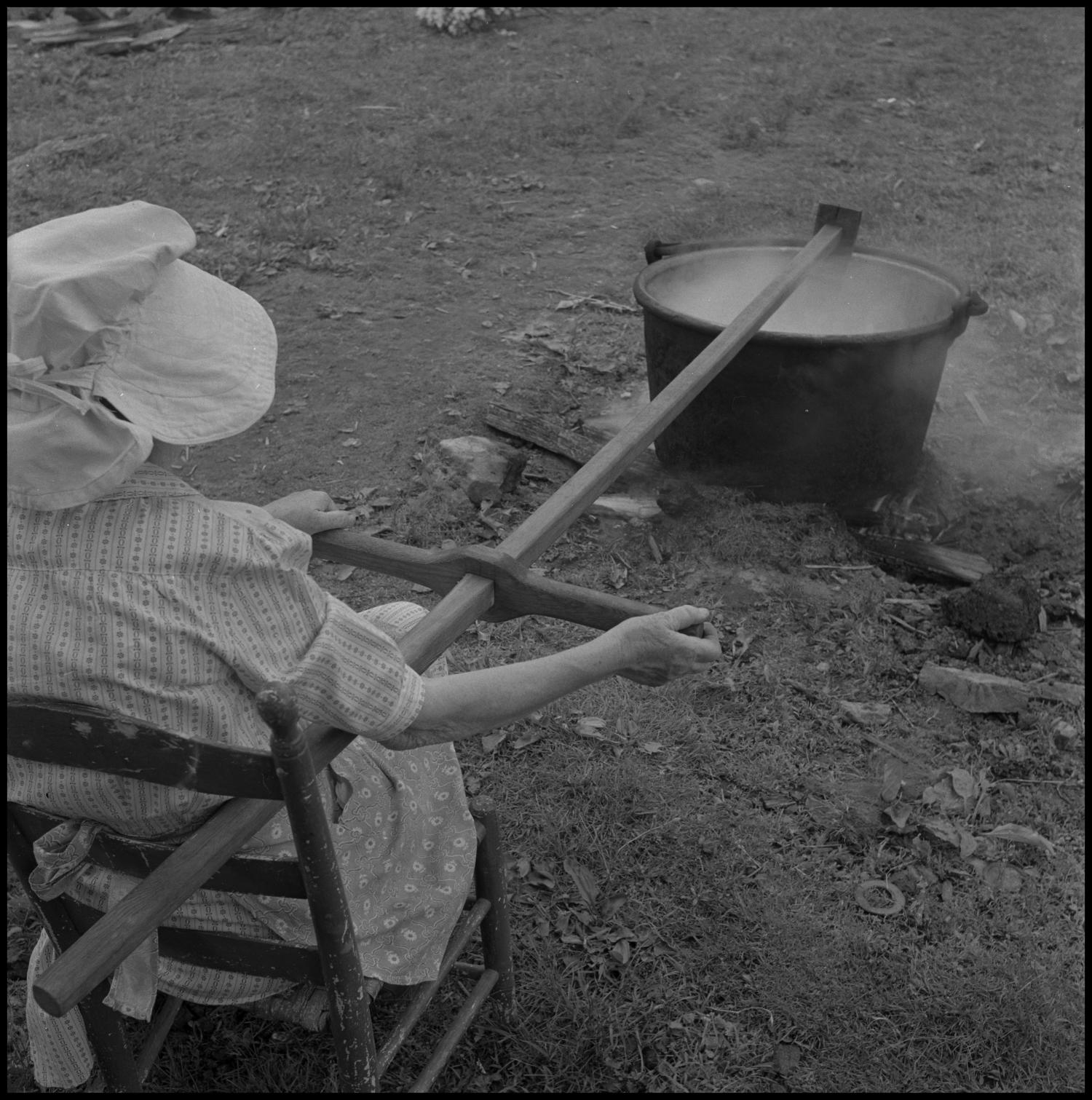 Woman stirring a large pot] - The Portal to Texas History