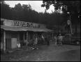 Thumbnail image of item number 1 in: '[Outside of a general store, 2]'.