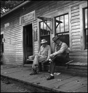 [Two men chatting on a porch, 2]