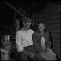 Photograph: [Young couple sitting together]