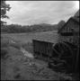 Photograph: [Watermill overlooking a field, 7]