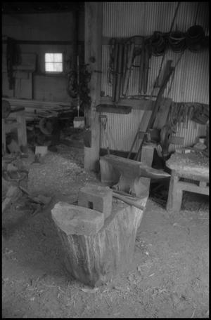 [Photograph of a workshop with an anvil, 1]