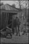 Thumbnail image of item number 1 in: '[Photograph of a man standing in front of a coop, 1]'.