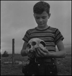 [Raymond Clark holding a human skull, 2]