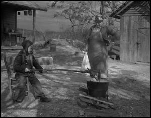 Primary view of object titled '[Stirring apple butter]'.