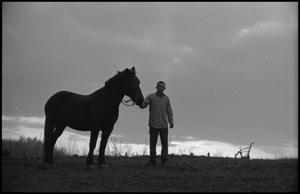 [A man and a horse on a hill, 14]