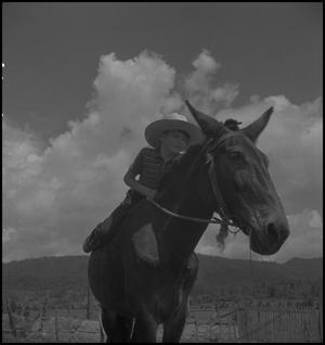 [Raymond Clark riding a mule, 2]