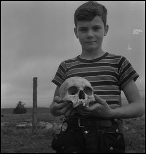 [Raymond Clark holding a human skull, 3]