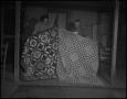 Photograph: [Iris Clark and Nora Treece showing quilts]