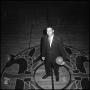Photograph: [Coach Charles Johnson standing with a basketball]