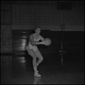 Primary view of [Bill Cutter holding a basketball]