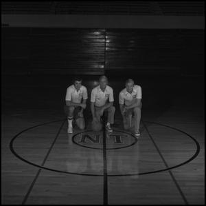 [Head Coach Gene Robbins with assistant coaches, 2]