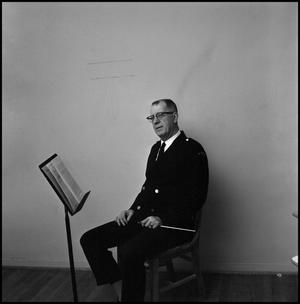 [Maurice McAdow sitting in a chair, 3]