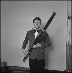 [UNT band tour member holding a bassoon, 2]