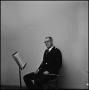 Photograph: [Maurice McAdow sitting in a chair, 2]