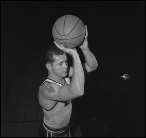[Bud Forman with a basketball]