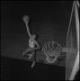 Photograph: [Zack Hayes jumping with a basketball]
