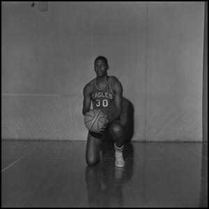[Alan Canselo kneeling with his basketball, 2]