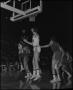 Photograph: [Basketball Players Chasing After Ball]