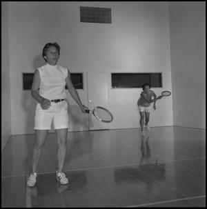 [Two women playing racquetball]