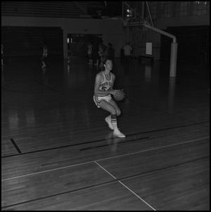 [Bill Cutter running with basketball, 2]
