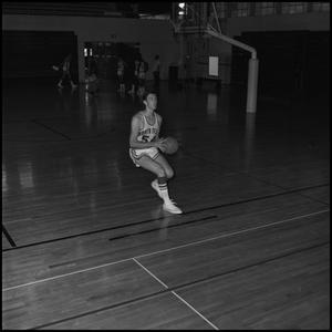[Bill Cutter running with basketball]