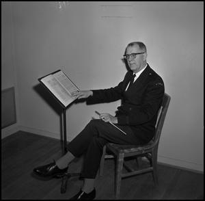 [Maurice McAdow sitting in a chair, 5]