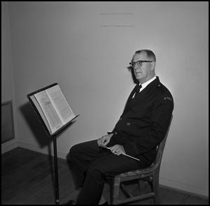 [Maurice McAdow sitting in a chair, 7]