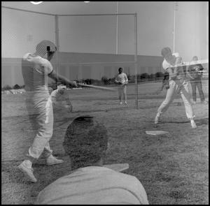 [Double exposure photo of a batter hitting the ball]