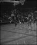 Photograph: [Men's Basketball Game in the Coliseum]