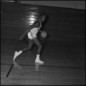 [A basketball player dribbling the ball, 2]