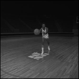 [Eagles basketball player on court]