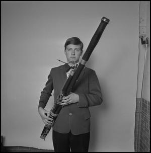 [UNT band tour member holding a bassoon, 3]