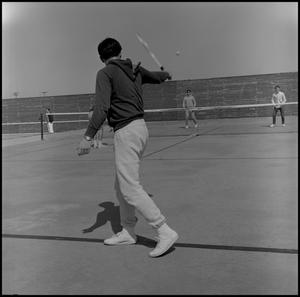 [Men playing tennis]