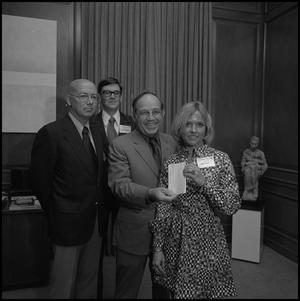 [President Nolen receiving a check from representatives of Atlantic Richfield]