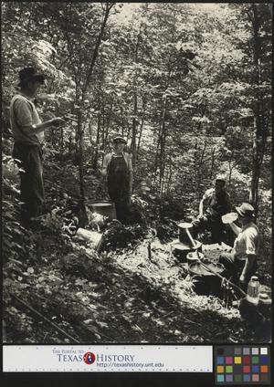 [Armed Moonshiners Pause for a Drink in Woods (2)]