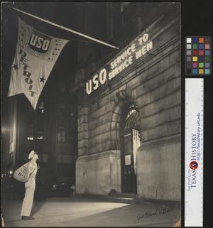 Primary view of object titled '[Man at the USO Building]'.