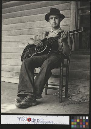 [Unidentified Man with Guitar]
