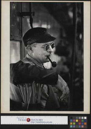 [Portrait of an unidentified man smoking a pipe]