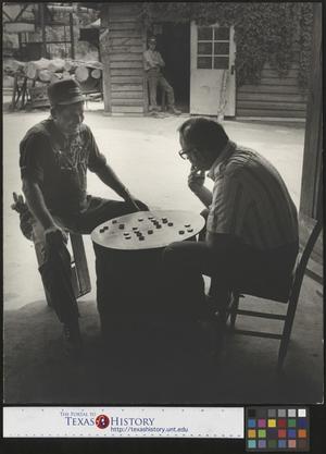 [Two men playing checkers]