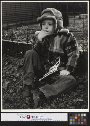 [Boy in Fall Clothing with Toy Gun]