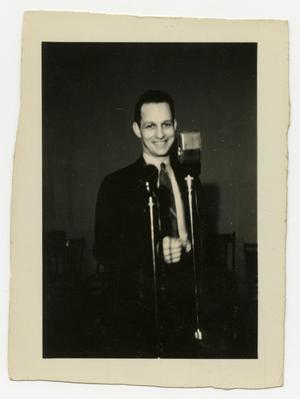 Primary view of object titled 'Man at microphone'.
